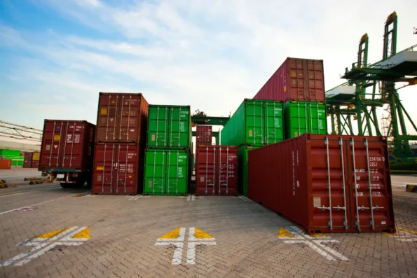 cargo containers at shipping port dusk